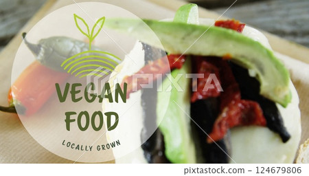 Vegan food image over close-up of fresh vegetables and text Locally Grown Vegan food image over close-up of fresh vegetables and text Locally Grown 124679806