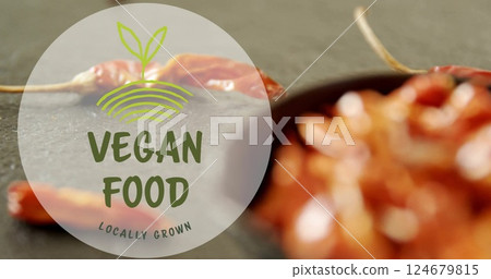 Vegan food locally grown image over blurred image of dried chili peppers 124679815