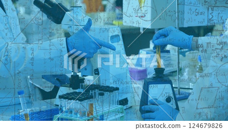 Mathematical equations image over scientists working with lab equipment and test tubes 124679826