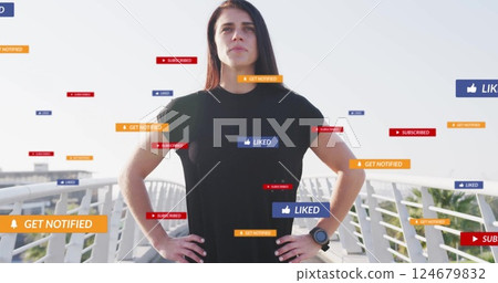 Standing on bridge, woman surrounded by social media notifications image 124679832