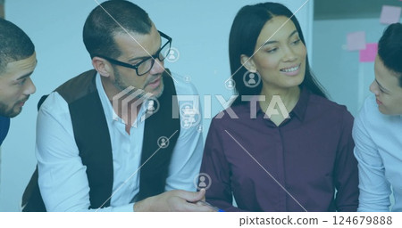 Image of people icons over diverse business people in office 124679888