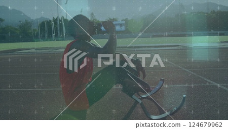 Athlete with prosthetic legs drinking water, digital grid image over track field 124679962