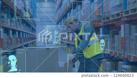 Facial recognition image over warehouse worker handling large box Facial recognition image over warehouse worker handling large box 124680023