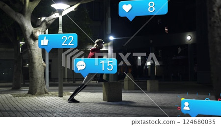 Social media notifications image over person walking in urban night setting Social media notifications image over person walking in urban night setting 124680035