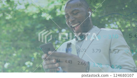 Image of financial data processing over african american man using smartphone Image of financial data processing over african american man using smartphone 124680107