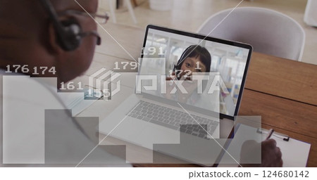 Image of digital data processing over african american businessman on laptop video call 124680142