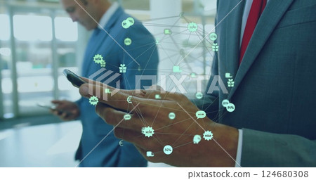 Image of global retail and business network over caucasian businessman using smartphone Image of global retail and business network over caucasian businessman using smartphone 124680308