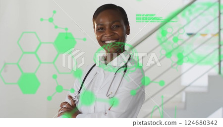 Image of green medical data processing over african american female doctor smiling at hospital 124680342