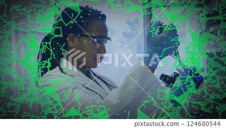 Image of scientific data processing over african american female scientist in laboratory Image of scientific data processing over african american female scientist in laboratory 124680544
