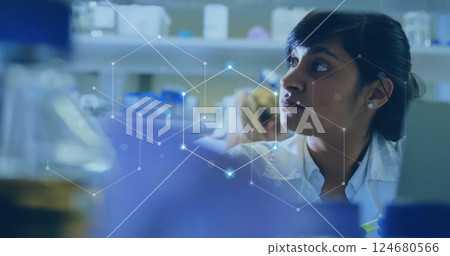 Image of scientific data processing over biracial female scientist in laboratory Image of scientific data processing over biracial female scientist in laboratory 124680566