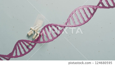 Image of dna strand spinning over pills on white background 124680595