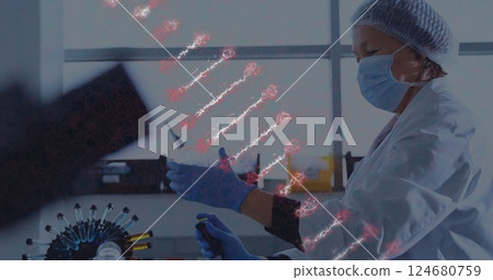Image of dna strand over caucasian female scientist in laboratory 124680759
