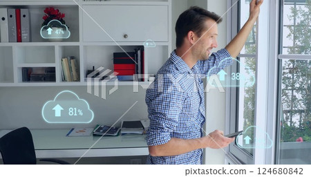 Image of clouds with growing numbers over caucasian man using smartphone Image of clouds with growing numbers over caucasian man using smartphone 124680842