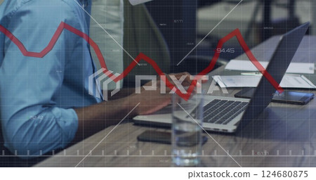 Image of diagram and data processing over biracial colleagues using laptop in office Image of diagram and data processing over biracial colleagues using laptop in office 124680875