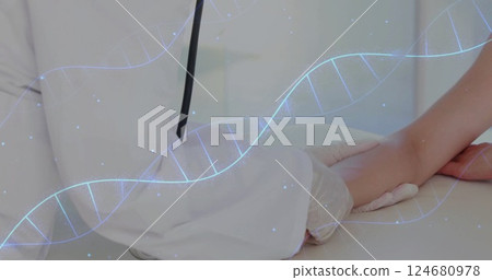 Image of dna strands over caucasian male doctor examining patient Image of dna strands over caucasian male doctor examining patient 124680978
