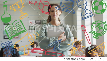 Image of school items icons over diverse female teacher with schoolchildren in classroom 124681713