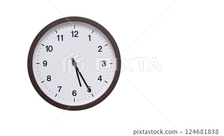 A simple round wall clock with a dark brown frame and a white face displaying 05:25/17:25. Isolated on a white background, perfect for time-related concepts, deadlines, and schedule themes. 124681838
