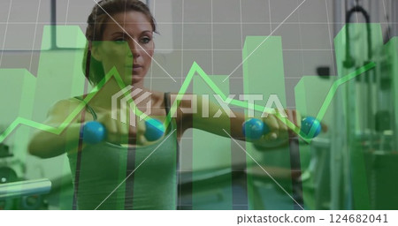 Image of financial data processing over caucasian woman exercising at gym Image of financial data processing over caucasian woman exercising at gym 124682041