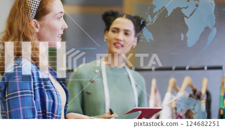 Image of financial data processing over diverse creative business people in office Image of financial data processing over diverse creative business people in office 124682251