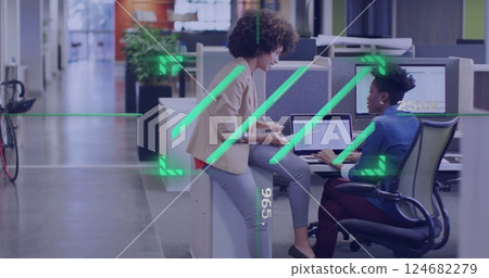 Discussing project over computer, colleagues in office with digital image overlay Discussing project over computer, colleagues in office with digital image overlay 124682279