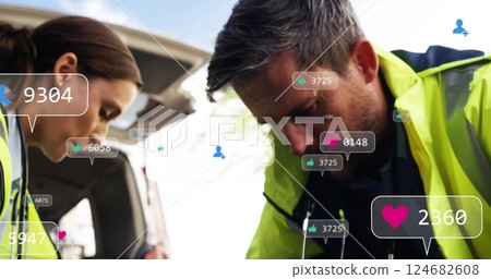 Social media interaction icons image over paramedics assisting patient near ambulance Social media interaction icons image over paramedics assisting patient near ambulance 124682608