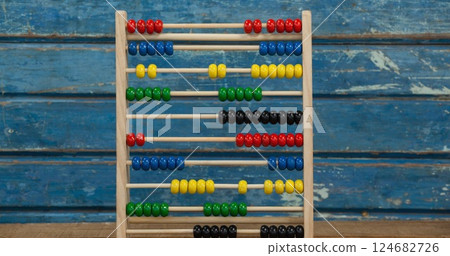 Wooden abacus on rustic table for learning and education in school setting Wooden abacus on rustic table for learning and education in school setting 124682726