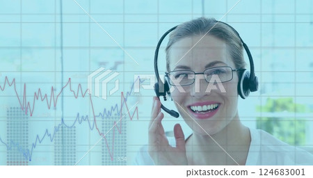 Image of data on graph processing over happy caucasian businesswoman wearing headset Image of data on graph processing over happy caucasian businesswoman wearing headset 124683001