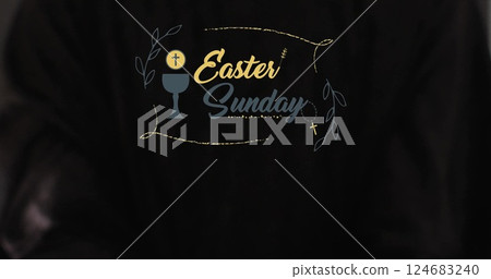 Image of eastersunday text with biracial woman's hands on black background 124683240