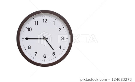 A simple round wall clock with a dark brown frame and a white face displaying 04:45/16:45. Isolated on a white background, perfect for time-related concepts, deadlines, and schedule themes. 124683273