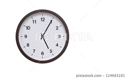 A simple round wall clock with a dark brown frame and a white face displaying 05:05/17:05. Isolated on a white background, perfect for time-related concepts, deadlines, and schedule themes. 124683281