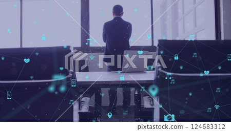 Image of network of connections with icons over caucasian businessman thinking in office Image of network of connections with icons over caucasian businessman thinking in office 124683312
