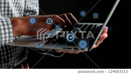 Image of data processing with scope scanning over caucasian businessman using laptop Image of data processing with scope scanning over caucasian businessman using laptop 124683313
