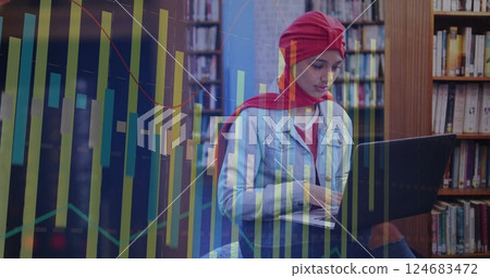 Image of diagrams over biracial female student using laptop 124683472