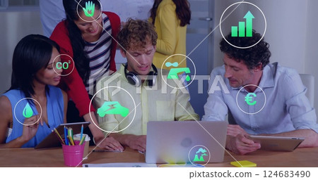 Image of eco icons and data processing over diverse business people in office 124683490
