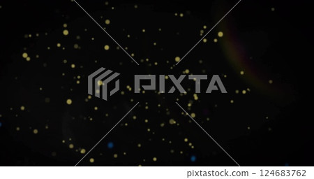Image of glowing light spots moving over black background Image of glowing light spots moving over black background 124683762