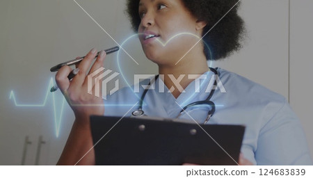 Image of cardiograph and heart over biracial female nurse talking on smartphone Image of cardiograph and heart over biracial female nurse talking on smartphone 124683839