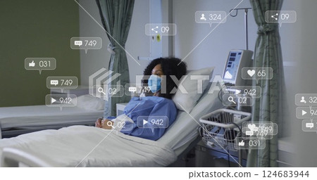 Image of social media icons with growing numbers over african american female patient Image of social media icons with growing numbers over african american female patient 124683944