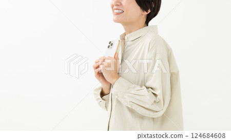 A woman operating a smartphone A woman operating a smartphone 124684608