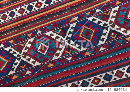Colorful Azerbaijani wool carpet featuring intricate geometric details 124684684