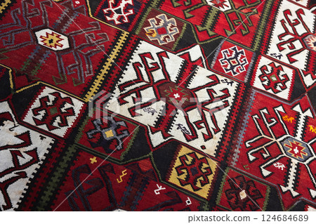 Red Azerbaijani carpet showcasing detailed geometric designs Red Azerbaijani carpet showcasing detailed geometric designs 124684689