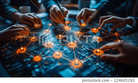 Business professionals collaborating at a roundtable, abstract network theme softly incorporated in the background 124685293