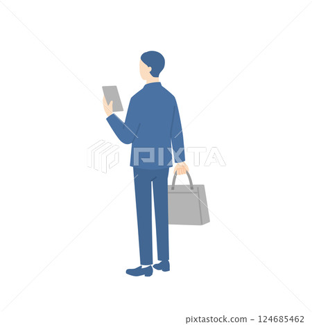 一位商人拿著商務包並檢查他的智慧型手機的後視圖 一位商人拿著商務包並檢查他的智慧型手機的後視圖 124685462