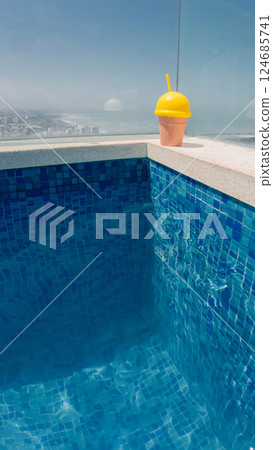 Refreshing summer drink by the pool on a sunny day 124685741