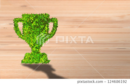 Sustainable Victory: Leafy Trophy Symbolizing Environmental Success on Wooden Background Sustainable Victory: Leafy Trophy Symbolizing Environmental Success on Wooden Background 124686192
