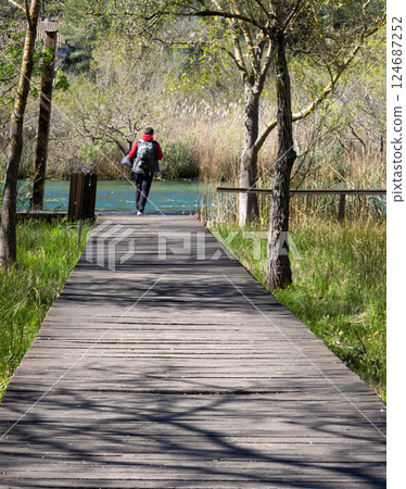 Tourist walking along the walkways of the Krka National Park, Croatia.Summer travel and tourism Tourist walking along the walkways of the Krka National Park, Croatia.Summer travel and tourism 124687252