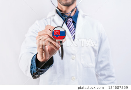 Slovakia healthcare system, doctor holding stethoscope. Slovakia health and medical insurance concept 124687269