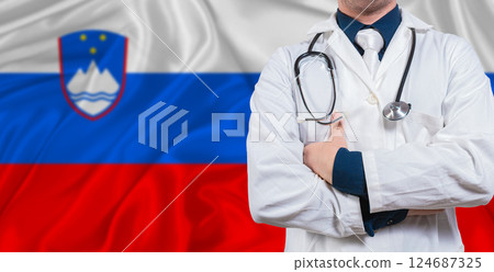 Male doctor with stethoscope on Slovenian flag. Doctor holding stethoscope on Slovenian flag Male doctor with stethoscope on Slovenian flag. Doctor holding stethoscope on Slovenian flag 124687325