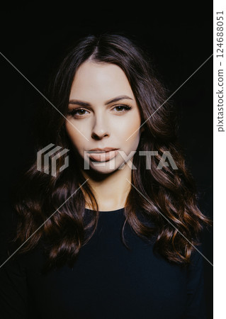Fashion model posing on black background 124688051
