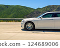 White sedan on scenic mountain route 124689006