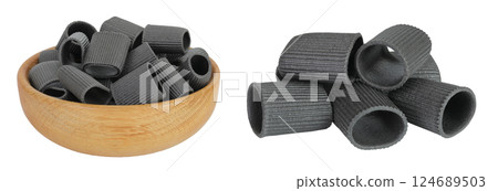 Black pasta with cuttlefish ink in wooden bowl isolated on white background 124689503